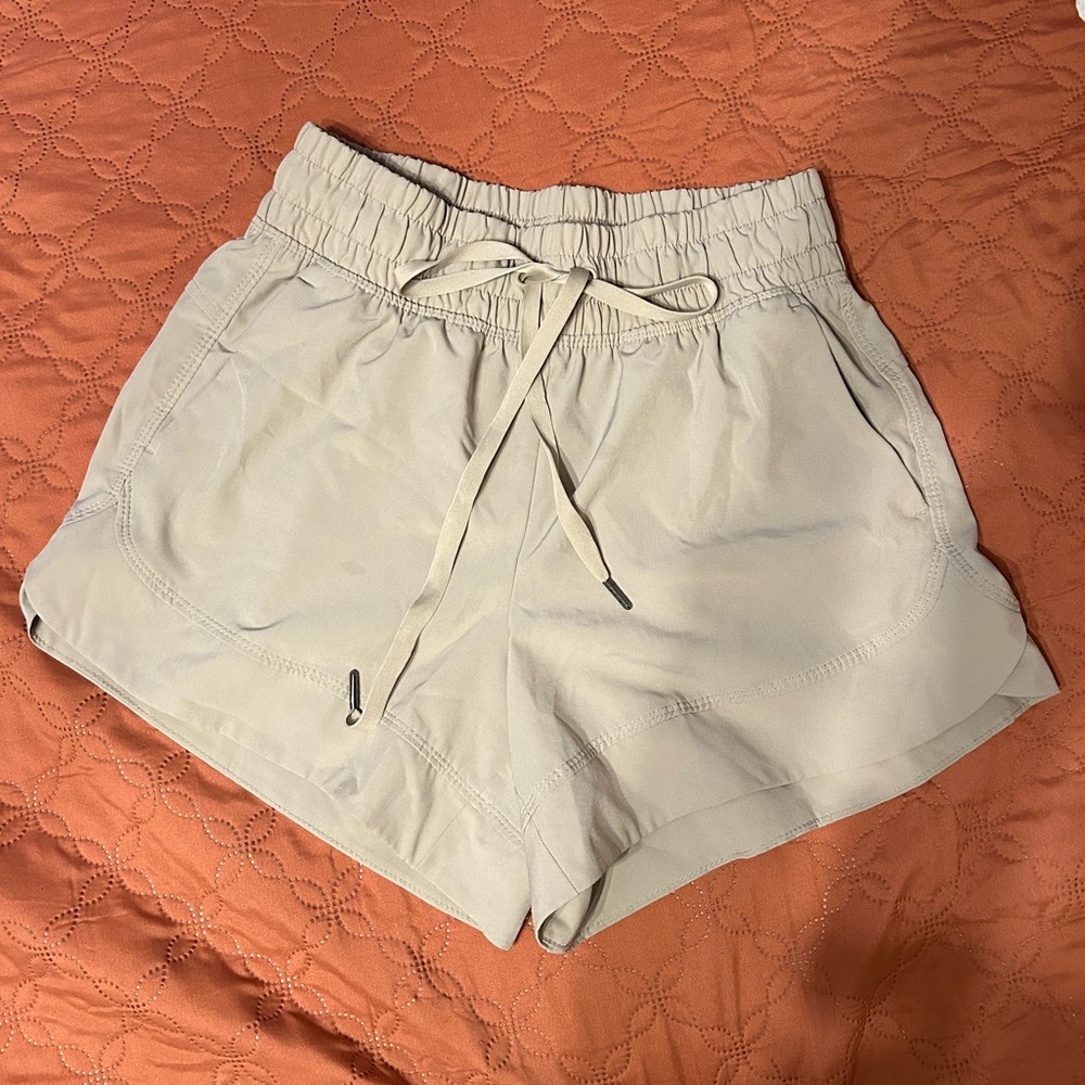 Apana polyester/spandex athletic shorts.